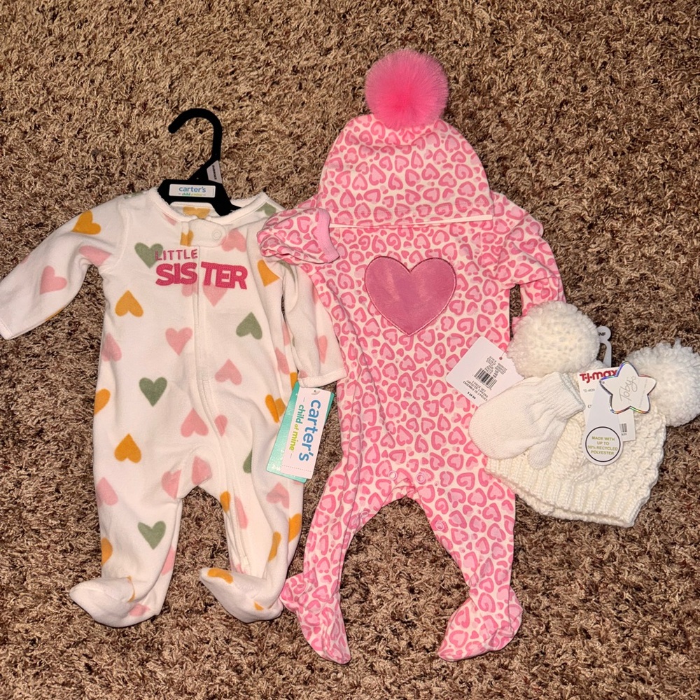 Newborn little girls onesies plus hat and gloves. Brand new never been worn.